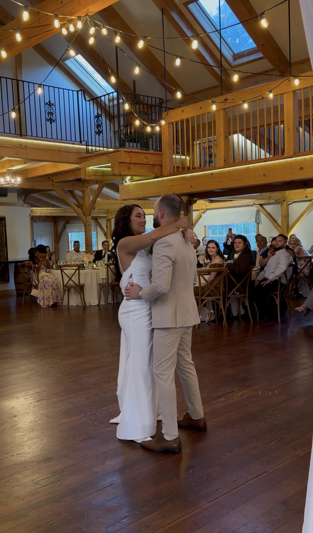 Yazmin & Nick's first dance beneath the barn's string-lit beams and open loft