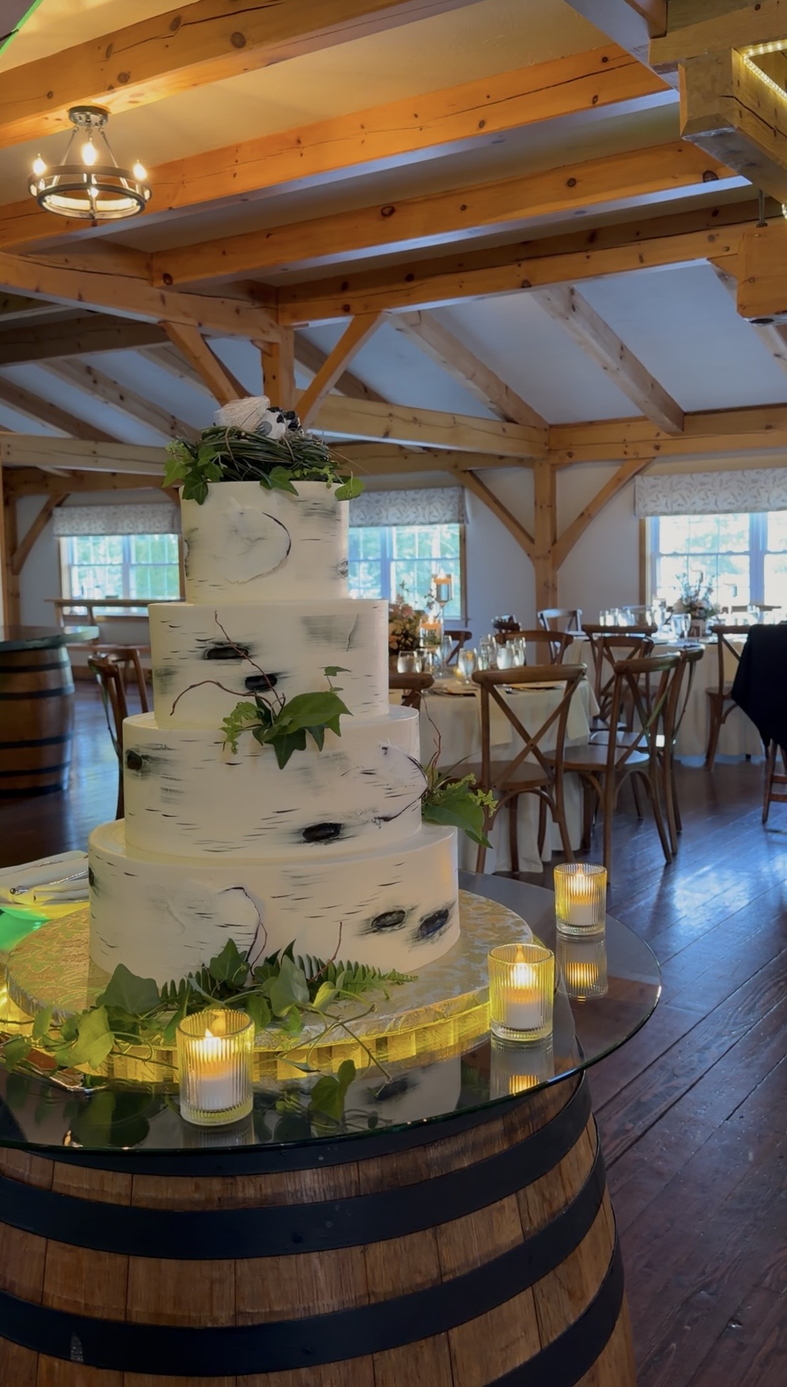 The 4-tiered wedding cake in the reception hall.
