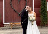 Johanna and Christian at the Zorvino Vineyards red barn during their romantic summer vineyard wedding in Sandown, NH