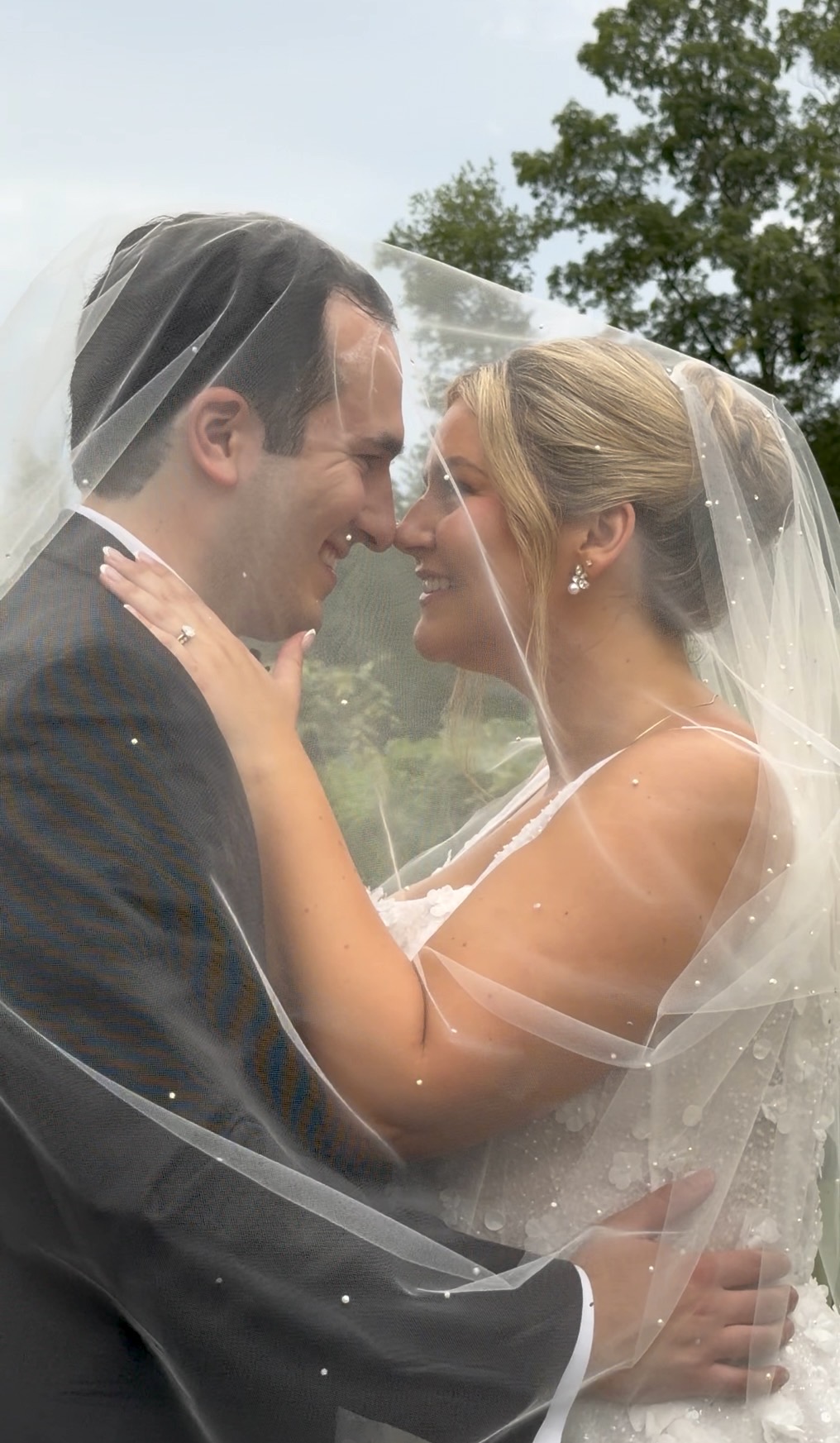 Bride and groom sharing a quiet, close moment at their romantic summer vineyard wedding at Zorvino Vineyard.