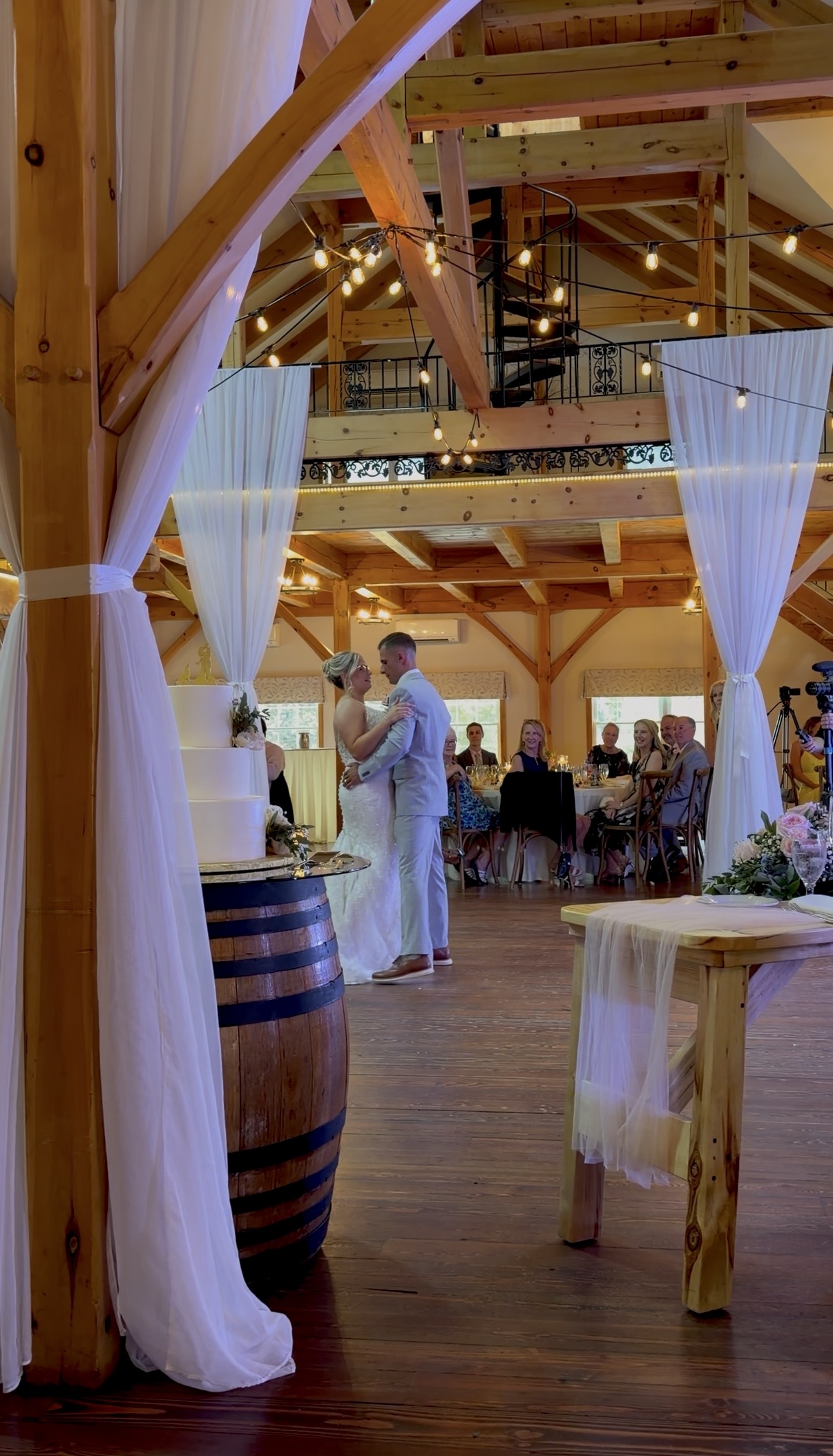 Bride and groom's first dance under Zorvino's timber-frame barn beams
