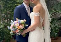 "Brittany Walters and Jesse Suhaka in the greenhouse conservatory at Zorvino Vineyards — summer wedding August 2026 Sandown NH"